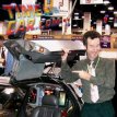 Standing next to the world-famous Back to the Future DeLorean